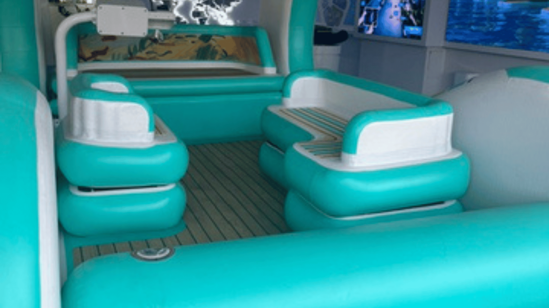 Interior of a modern autonomous electric inflatable craft with teal and white seating